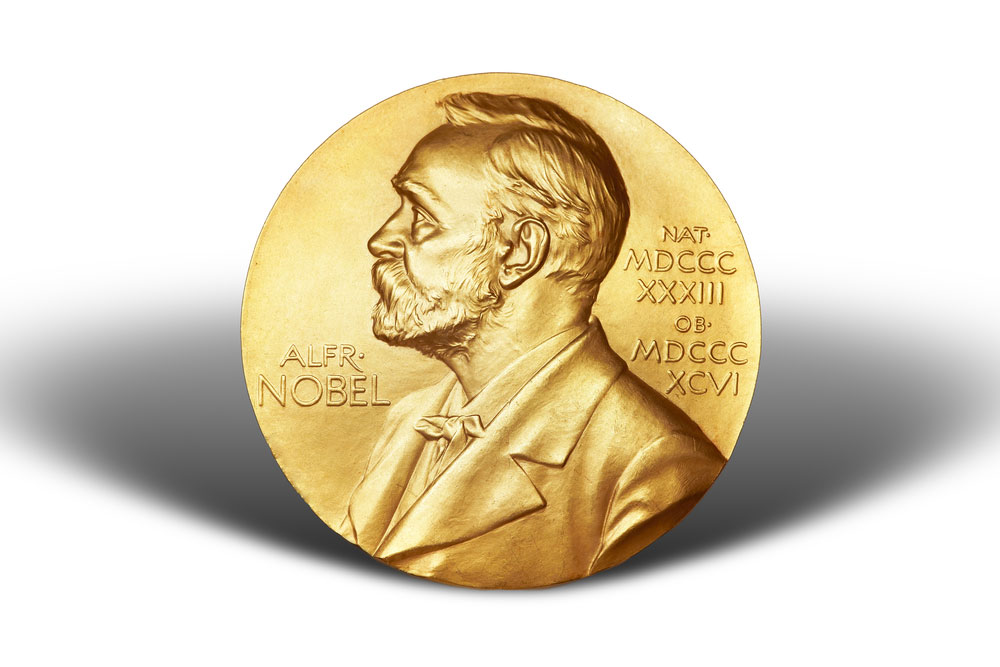 Gold Nobel Prize medal isolated on a white background