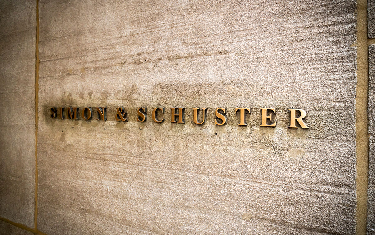 Brass Simon and Schuster sign on front of publisher headquarters in NYC