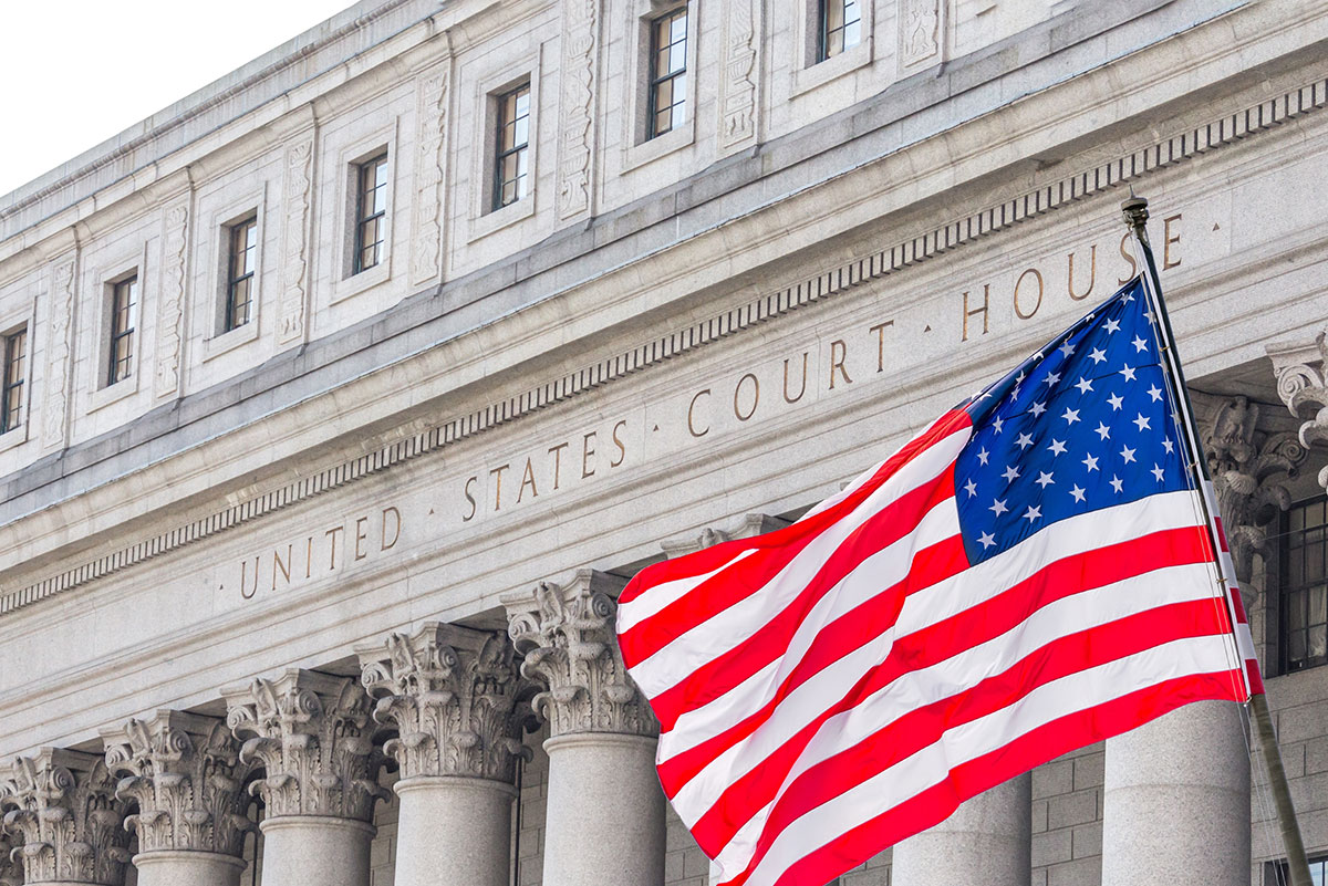 American flag flies in from of U.S. Court House in New York City