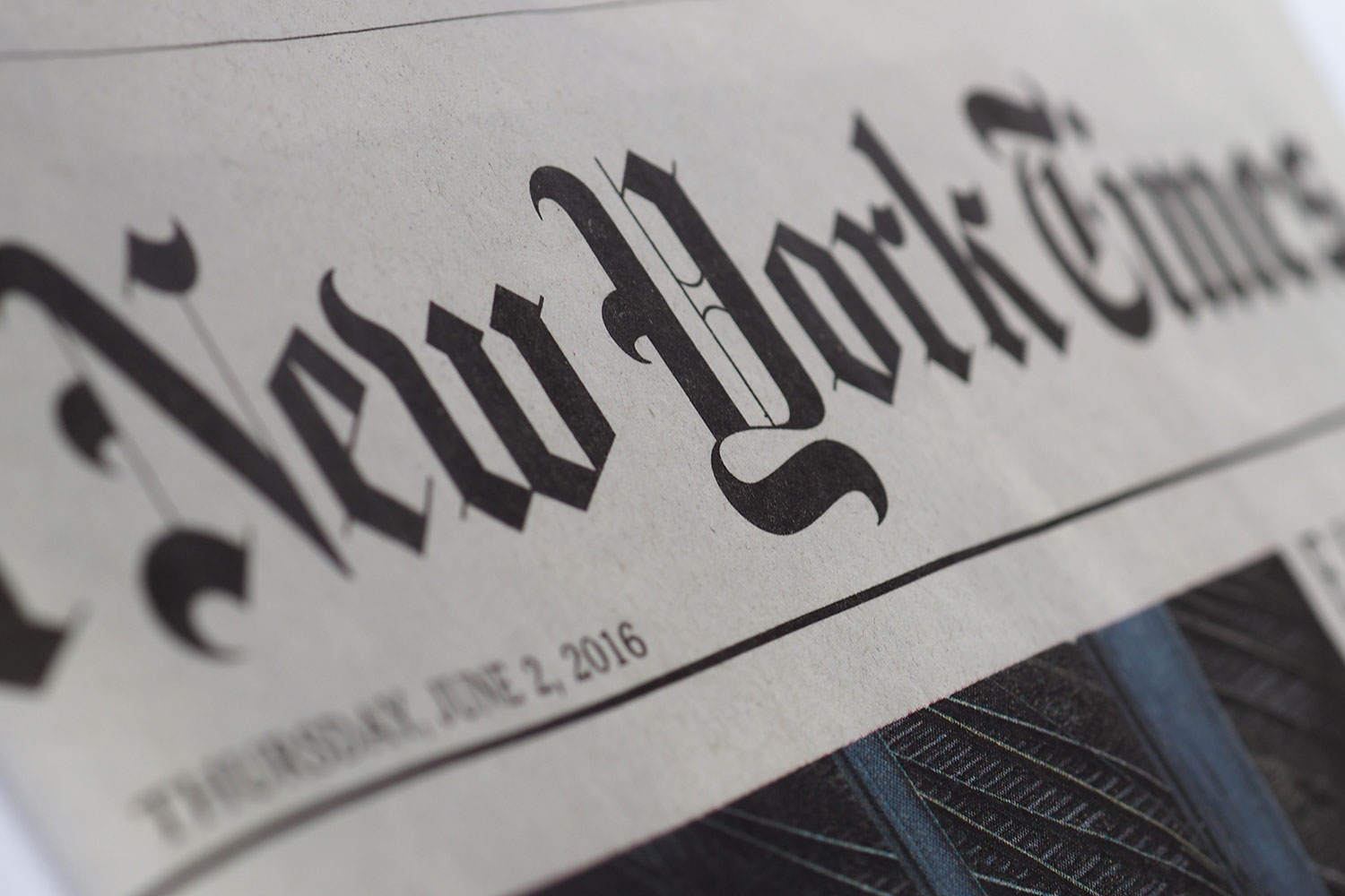 Close up of the front page of The New York Times focusing on the newspaper's logo