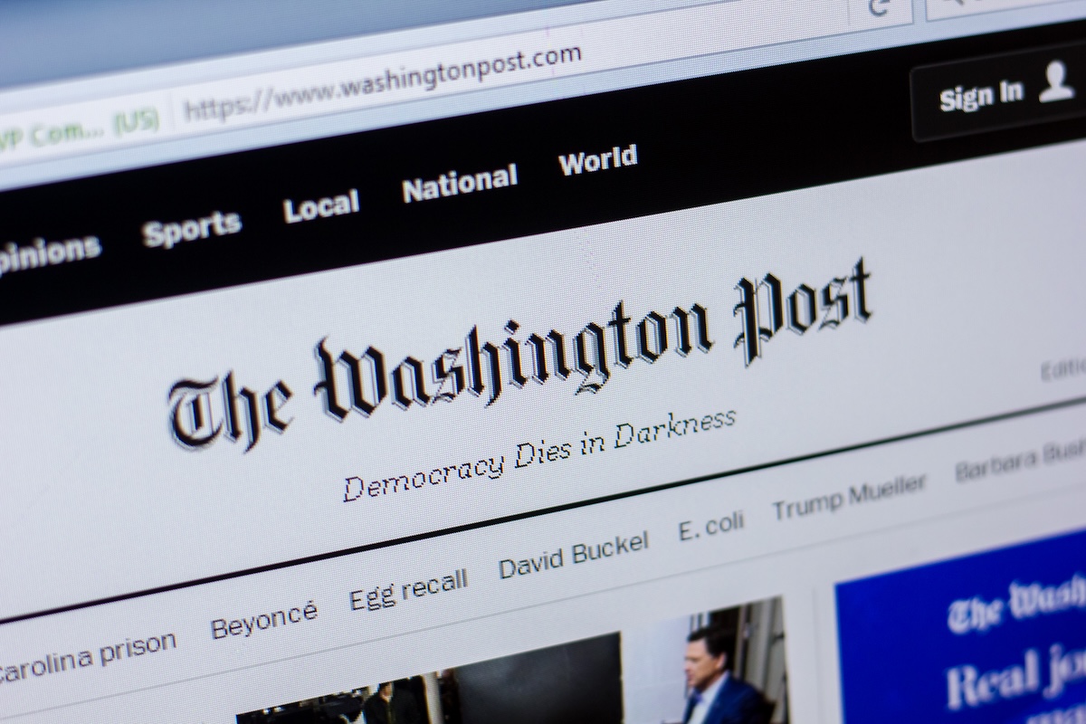 Photo of the front page of the Washington Post website with the slogan Democracy Dies in Darkness